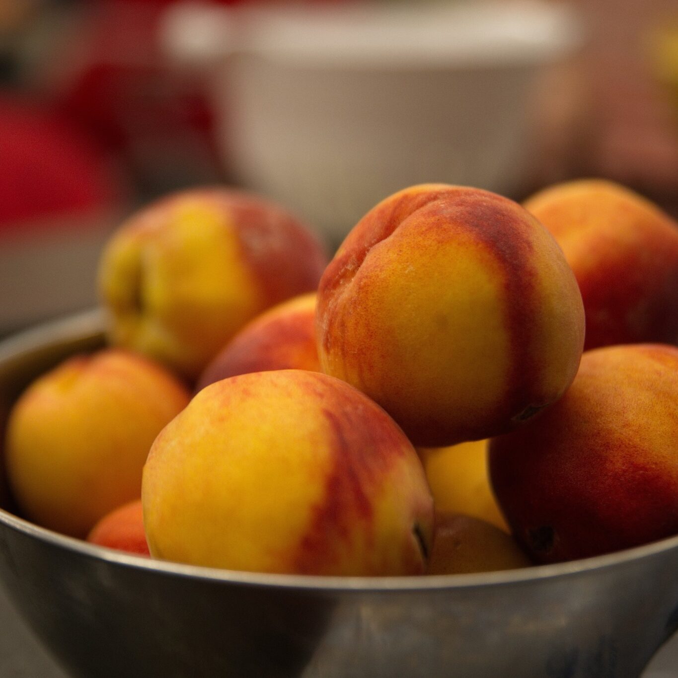 alt=”Bowl of peaches” aria-hidden=”true”